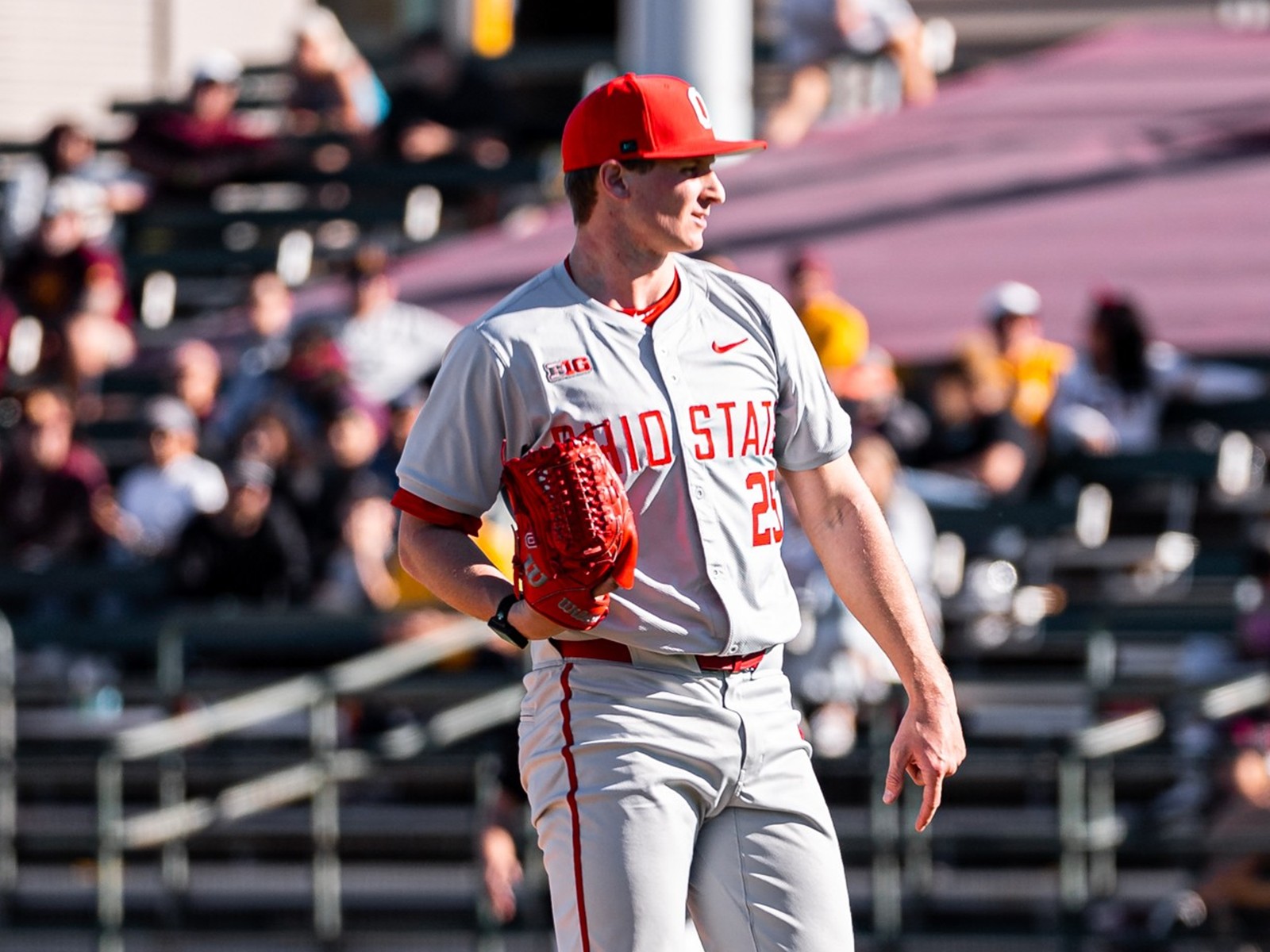 Luke Carrell pitching in an Ohio State uniform