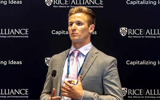 A SideCoach founder presenting at the Rice Alliance pitch competition