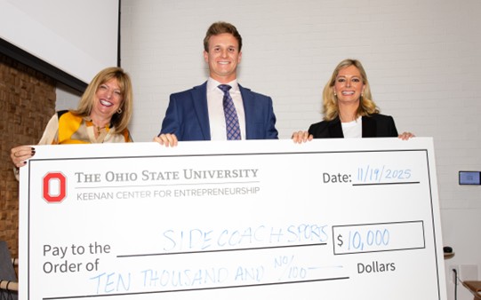 Accepting the Best of Student Startups award check at Ohio State in 2025